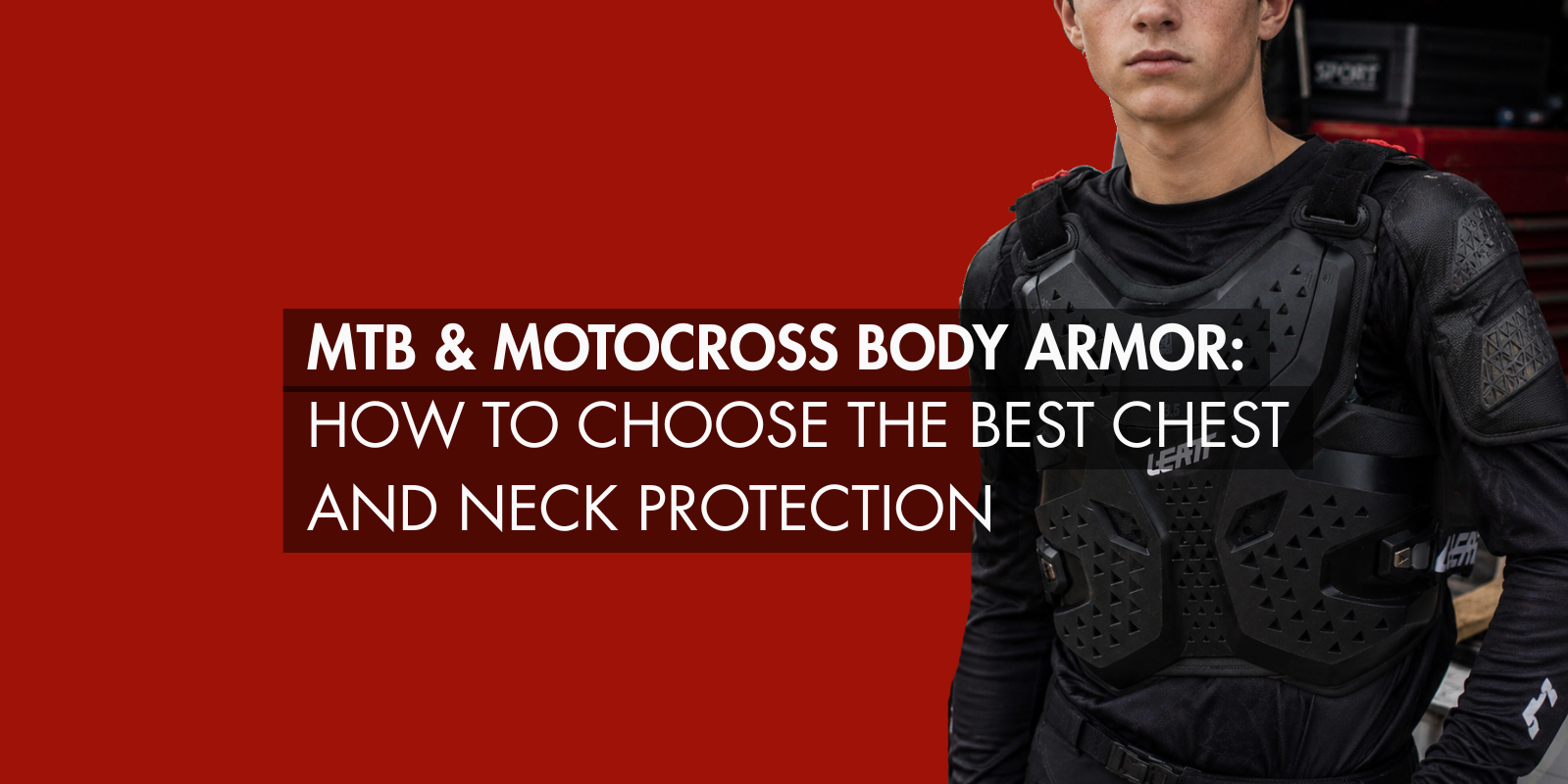Young motocross rider wearing black LEATT body armor standing beside a dirt bike and van in an outdoor motocross setting, showcasing modern chest protection gear for off-road riding.