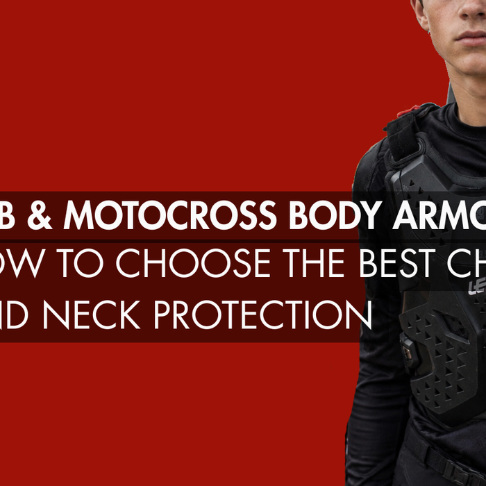 Young motocross rider wearing black LEATT body armor standing beside a dirt bike and van in an outdoor motocross setting, showcasing modern chest protection gear for off-road riding.